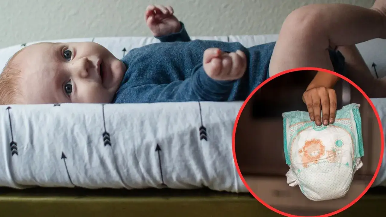Rodzic zmieniający pieluszkę niemowlęciu, z dylematem wyboru rozmiaru